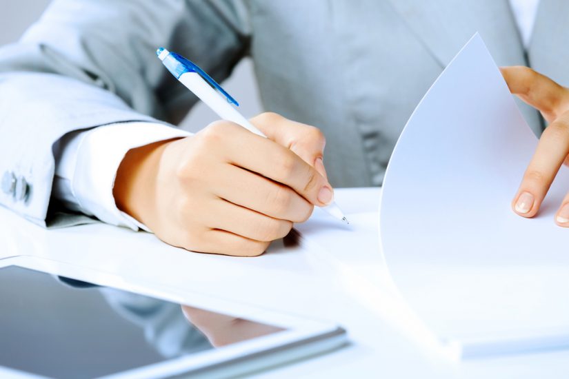 Man writing on documents